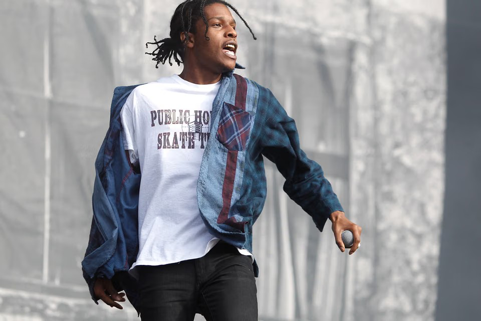 A$AP Rocky on stage wearing a Public Housing Skate Team tee